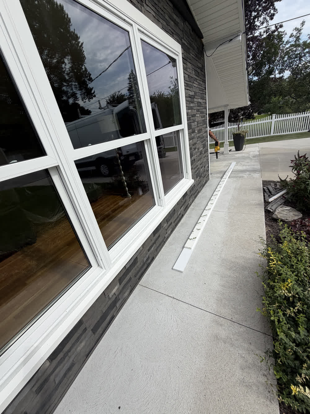 Finished large window installation on a stone exterior